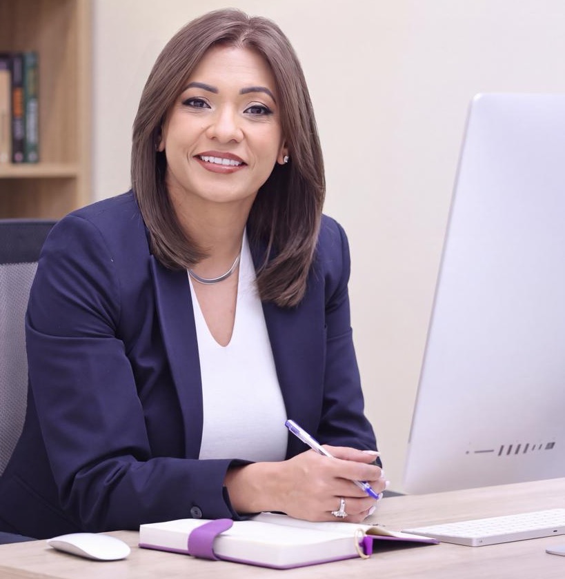 Megha Bhalla at her desk