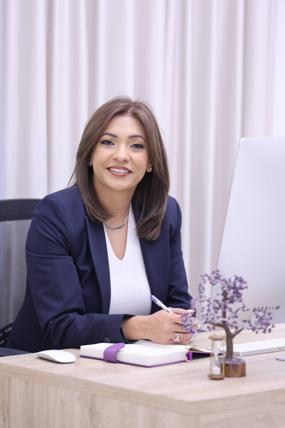 Megha Bhalla at her desk